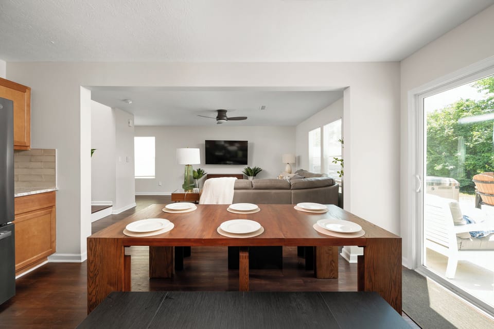 The open-concept dining area seamlessly connects the kitchen and family room, making it easy to share meals, conversation, and quality time together.