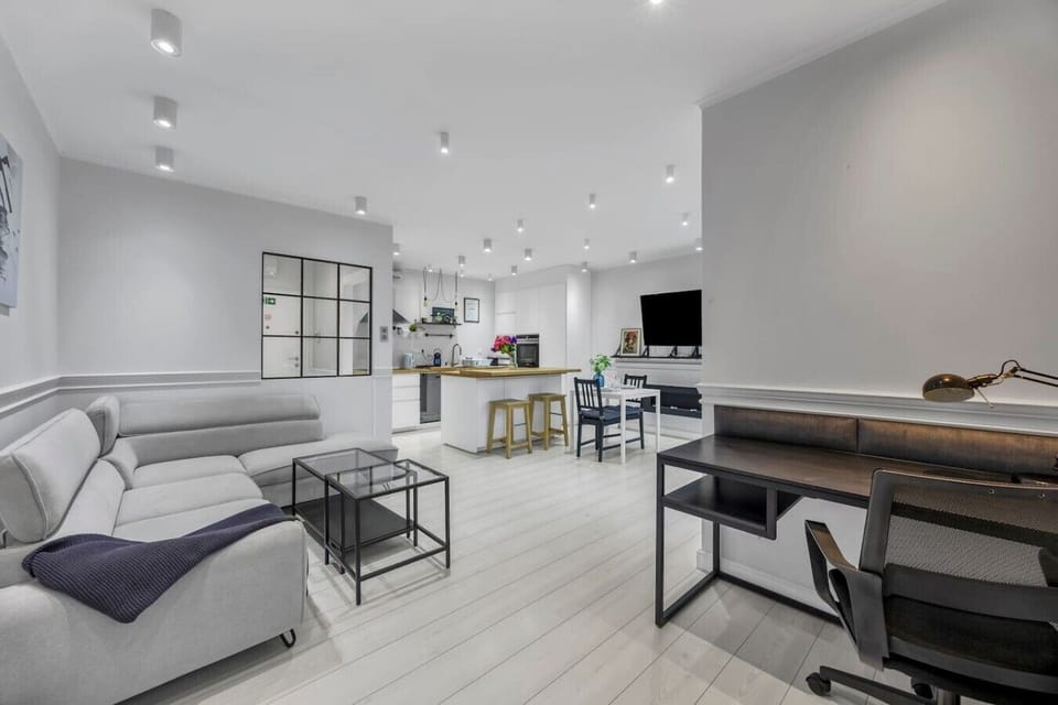 Modern Open-Plan Living Room with Designer Kitchen, Dining Area & Dedicated Workspace | Book Now with RENTUJEMY.COM