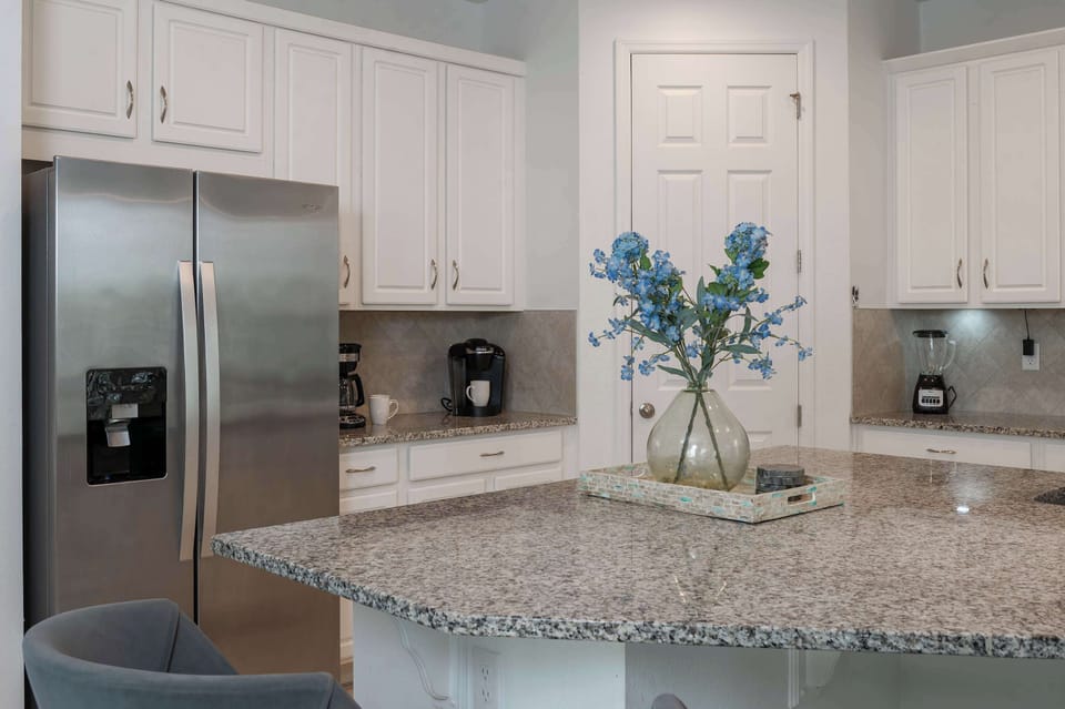Modern kitchen with granite countertops and stainless steel appliances