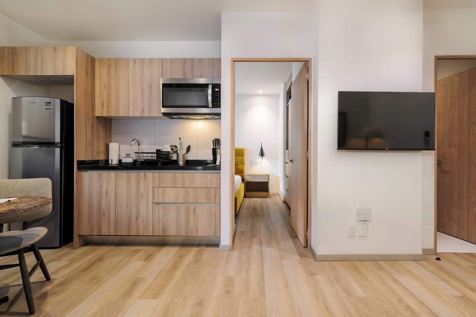 Fully equipped kitchen connected to the living area.
