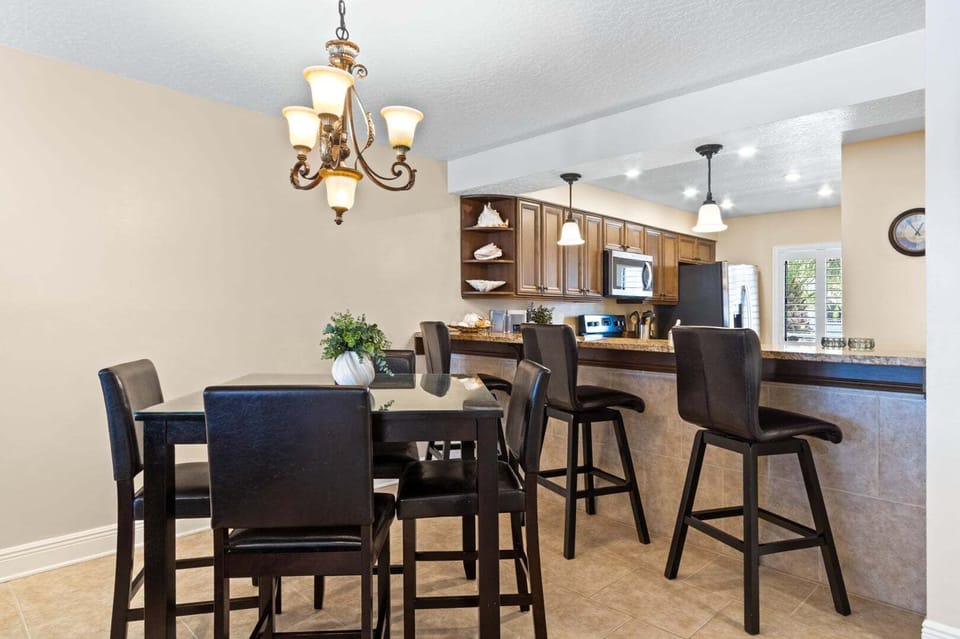 Breakfast bar seats three and dining table seats four