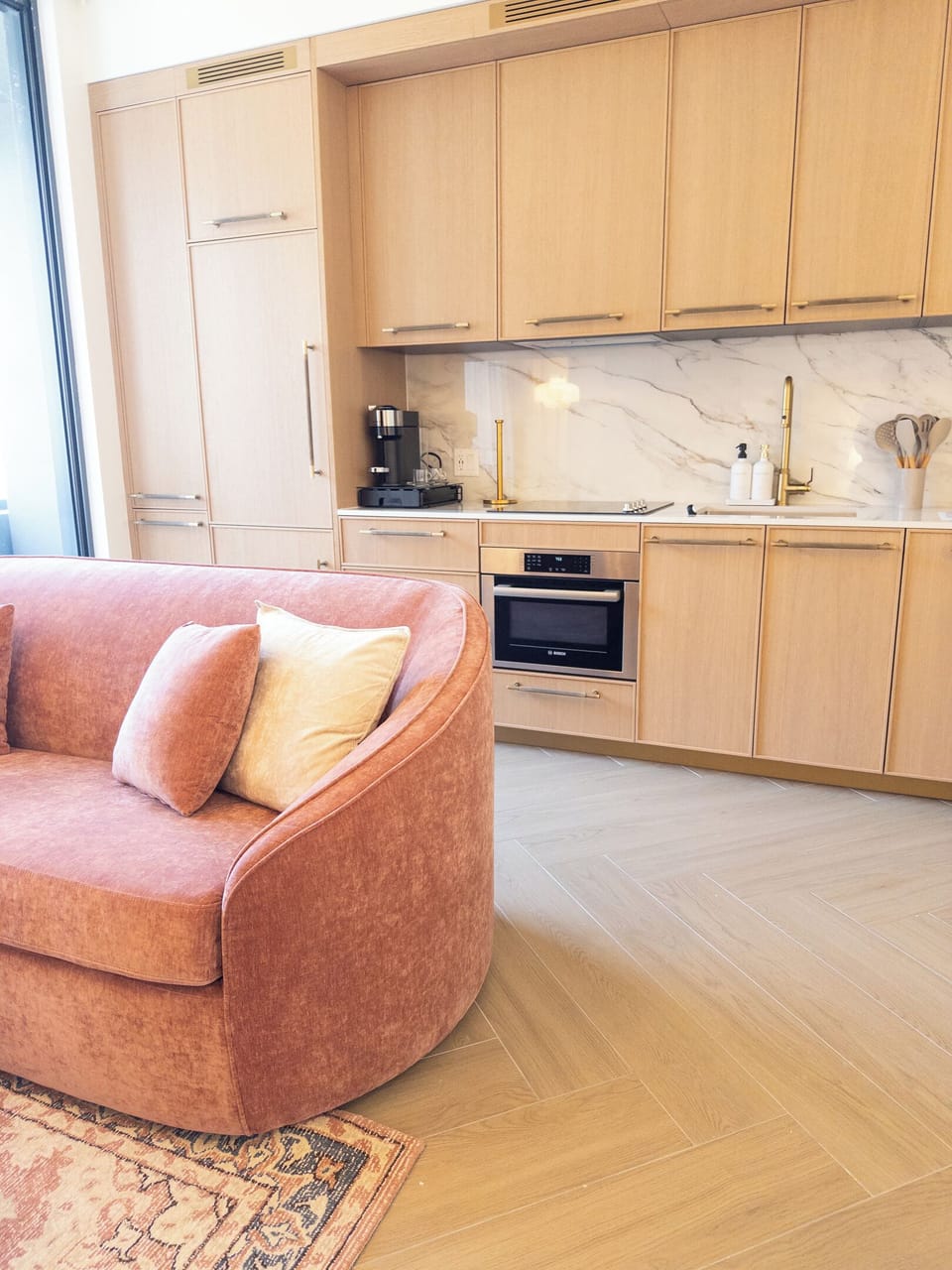 Open kitchenette flows into the living area - cook while you stay in the conversation.