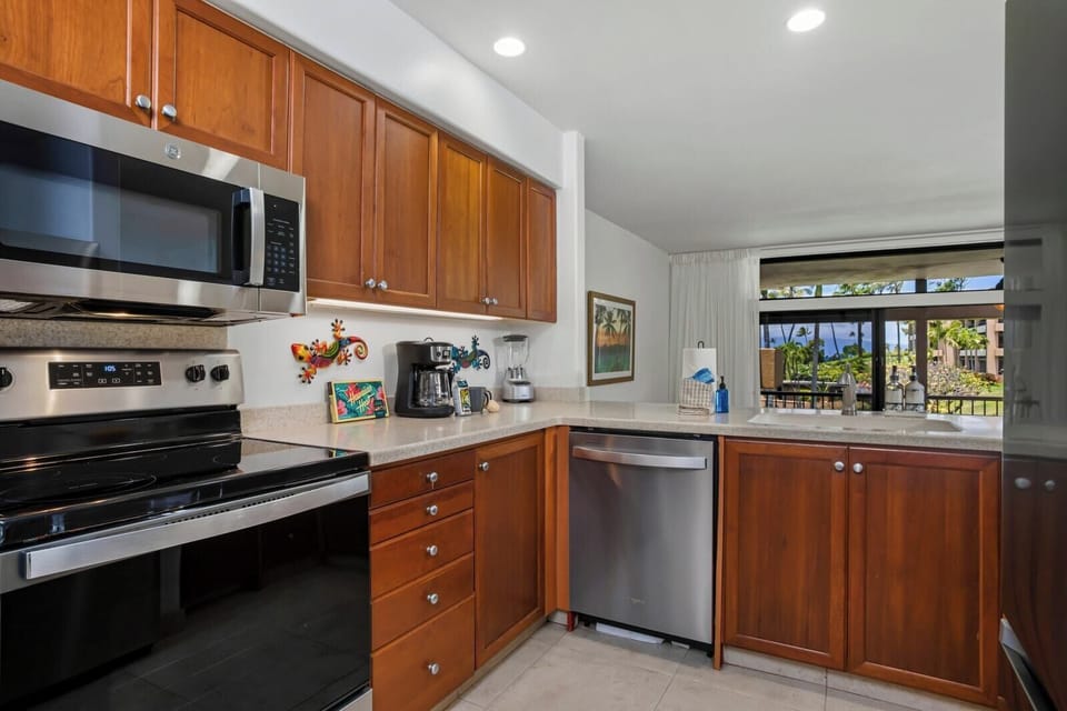 With sleek steel, warm wood, and playful island art, this kitchen invites you to stir up both flavor and fun     KRO-G201