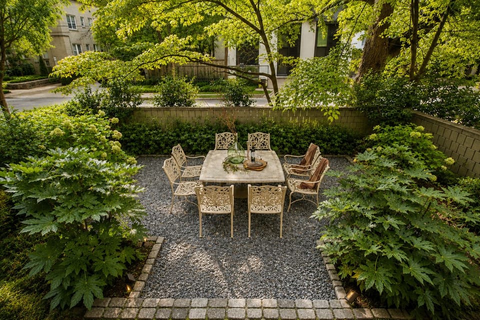 Tuscan Courtyard. A ultra-rare private garden oasis featuring manicured landscaping and a stone dining table with formal seating for 8.