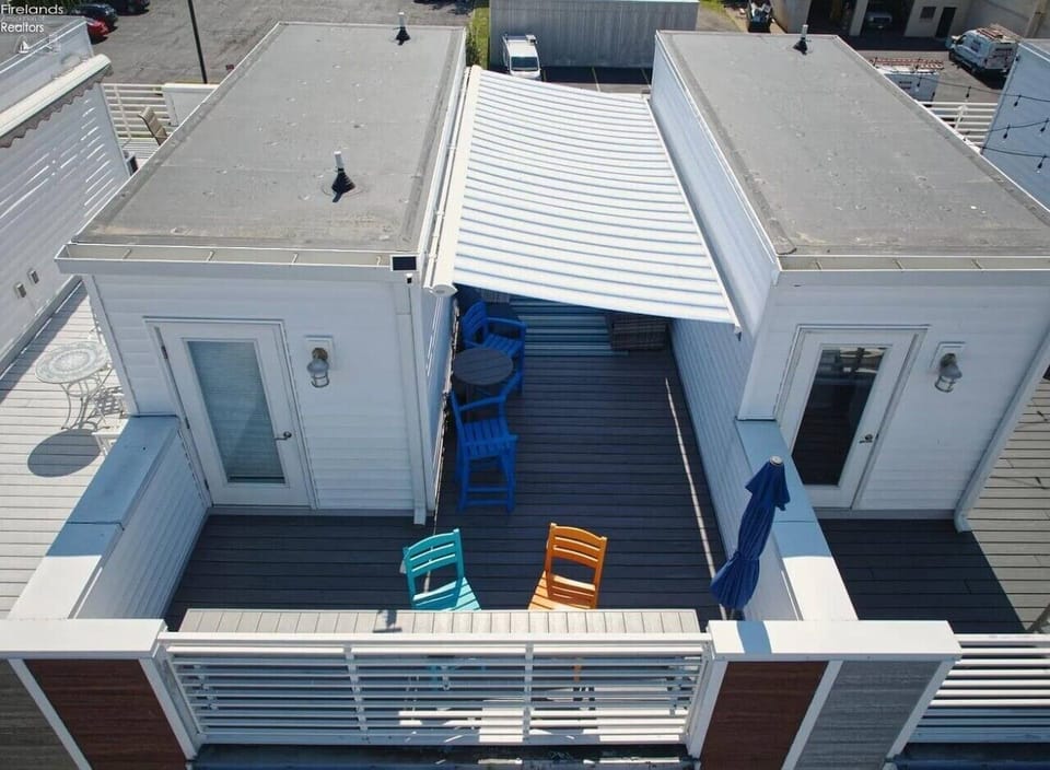 Your private rooftop deck offers both sunny and shaded seating areas for relaxing above downtown Sandusky.