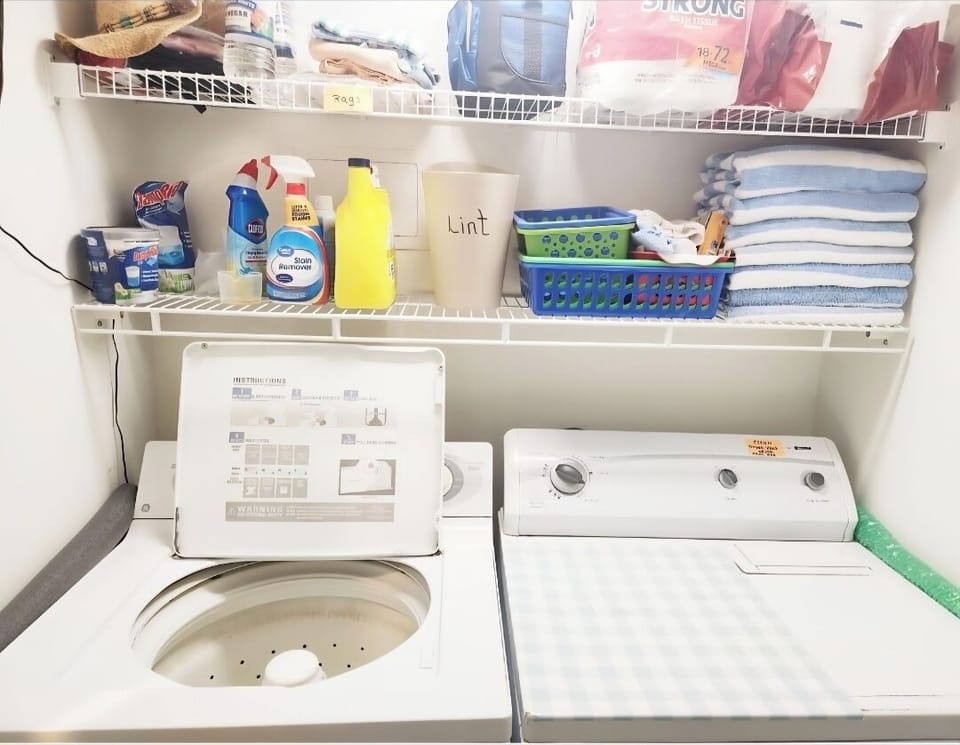 Laundry area with full size washer and dryer.  