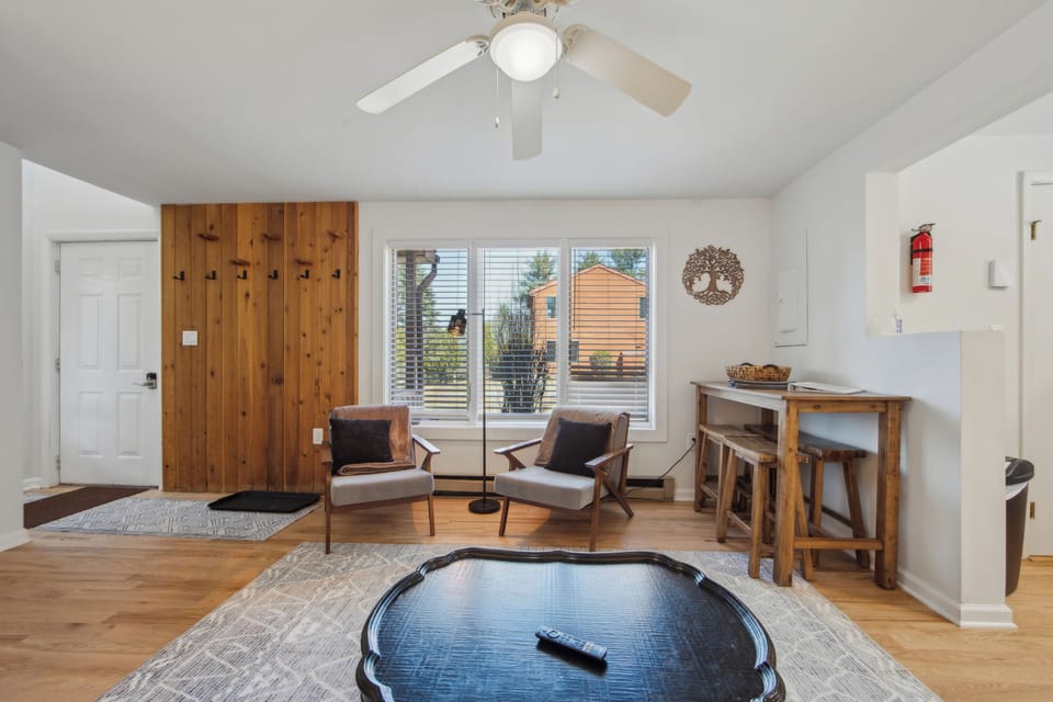 An alternative view of the main living area, highlighting the seamless layout and conversational seating arrangement.