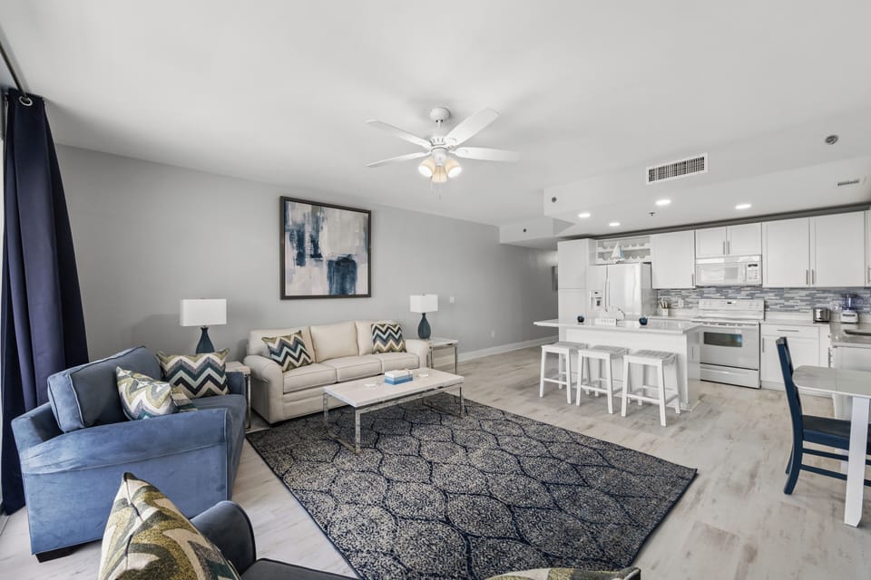 Unwind in your bright, open living space with plush seating and a fully-equipped kitchen, perfect for relaxing evenings or hosting friends and family.
