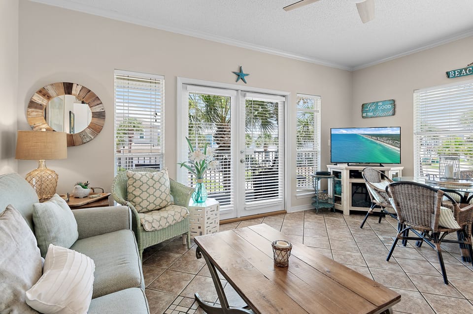 Cozy, charming living room with balcony access