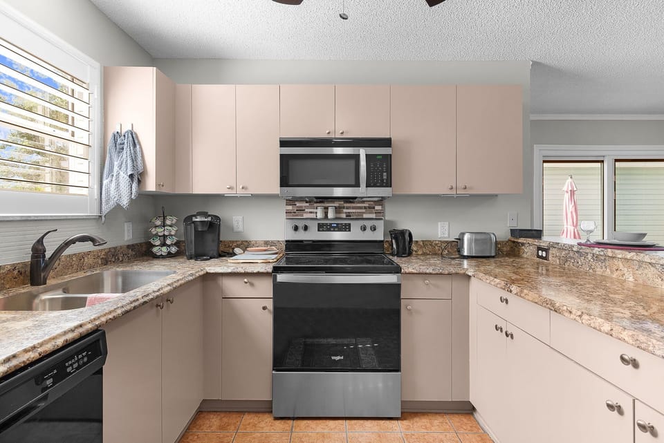 Your fully equipped kitchen has everything you need to prepare meals, with granite countertops, modern appliances, and plenty of counter space for easy cooking during your stay.