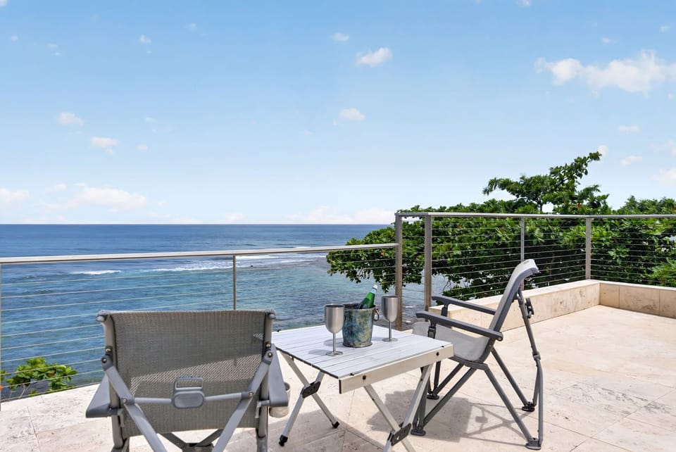Take in sweeping Pacific views from the oceanfront lanai, where outdoor seating and the sound of the waves create the perfect North Shore retreat.
