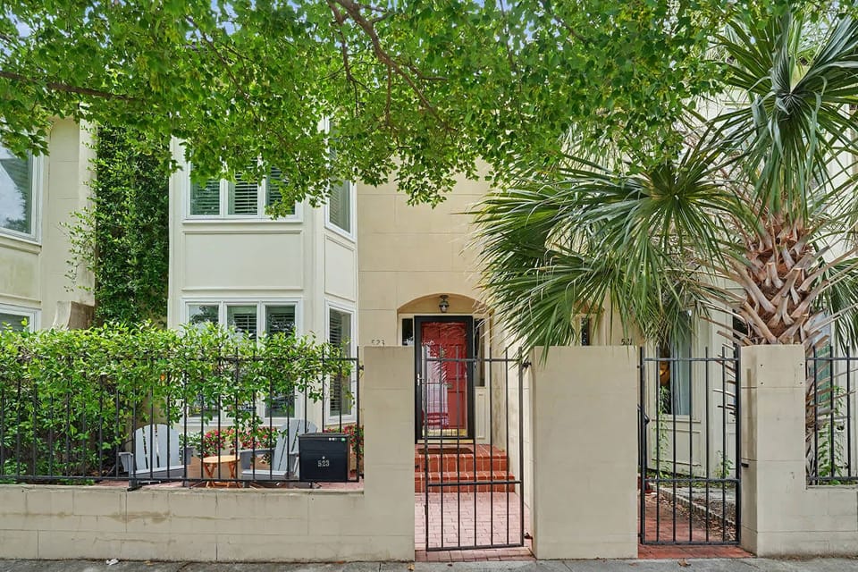 A beautiful exterior framed by vibrant greenery, offering a calm and inviting first impression!