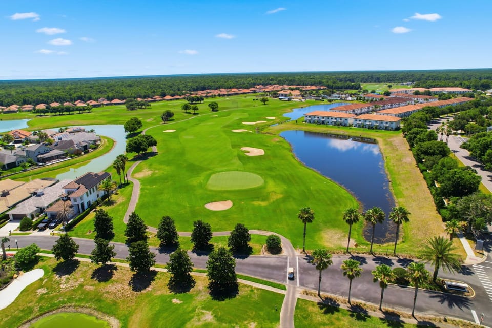 Beautiful aerial view showcasing the home’s prime golf-course community location.