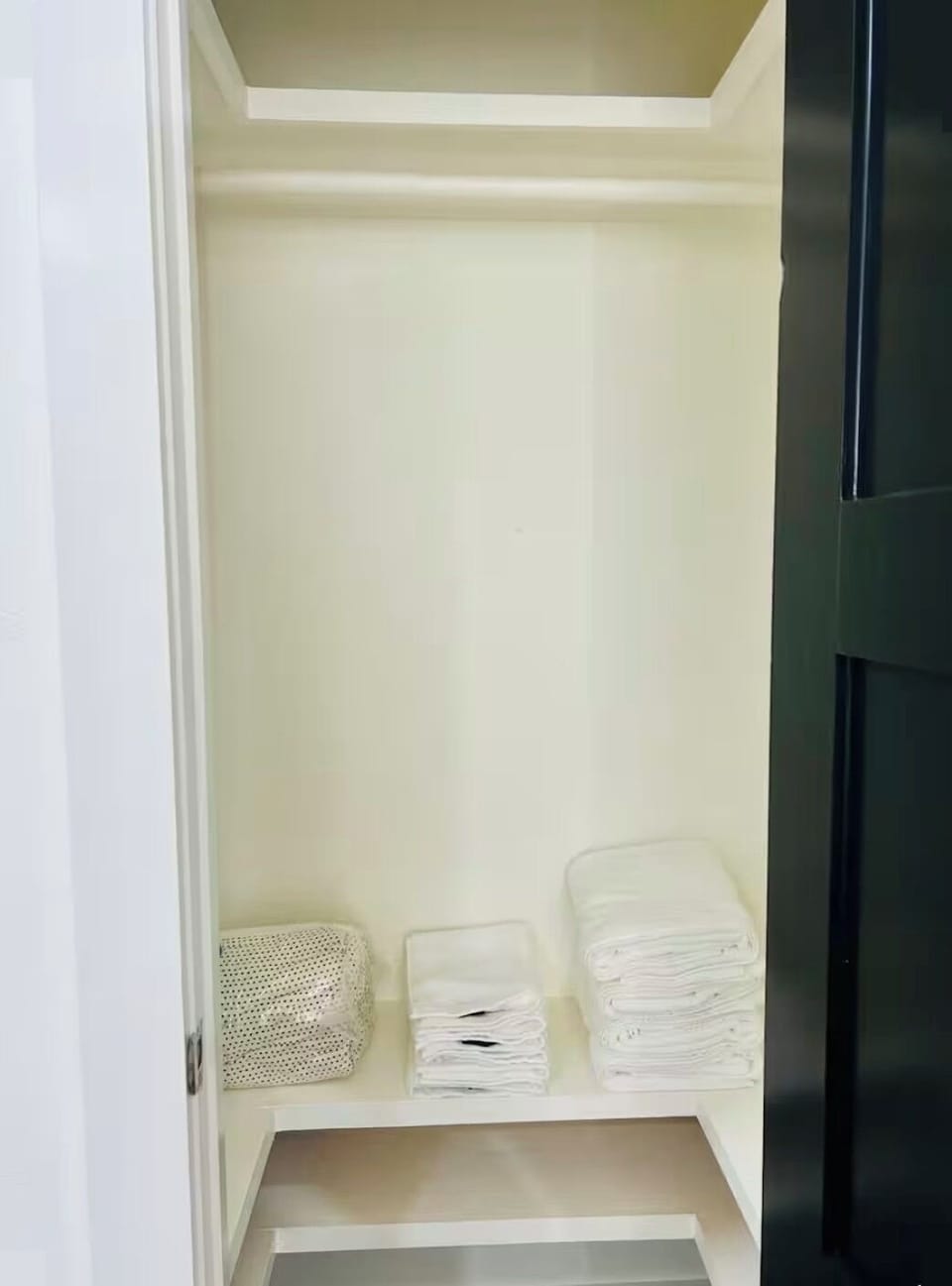 Closet with towels and extra blankets