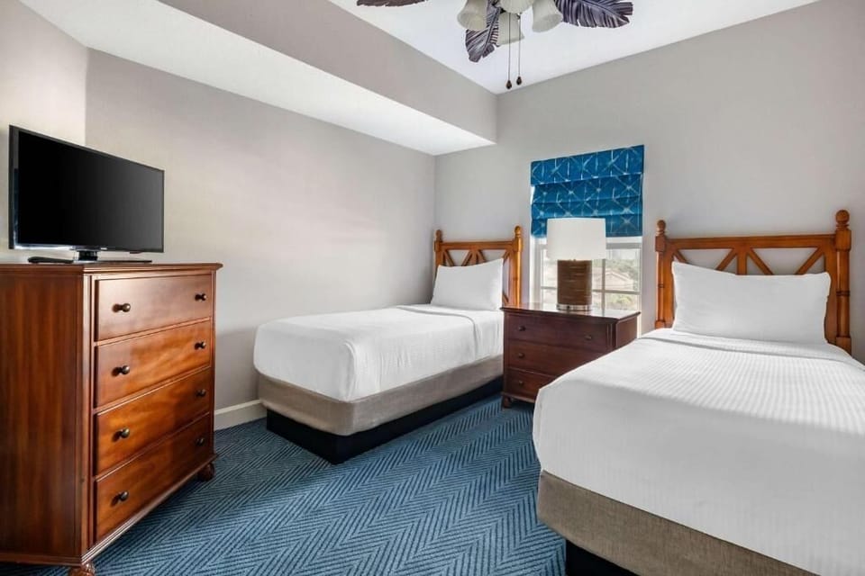 Settle in comfortably with twin beds and a TV dresser.