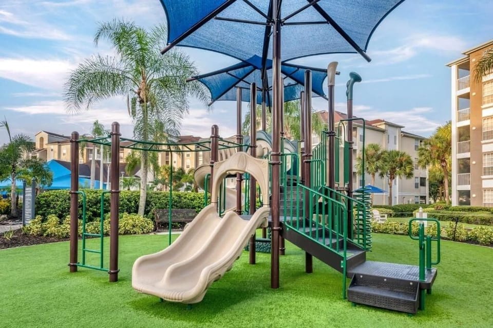 Let kids climb and slide under shady resort umbrellas.