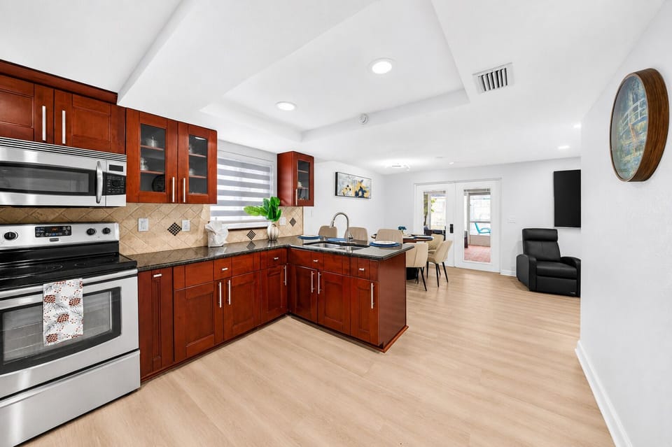 Spacious chef-friendly kitchen featuring modern appliances, abundant counter space, and everything needed to prepare home-cooked meals.