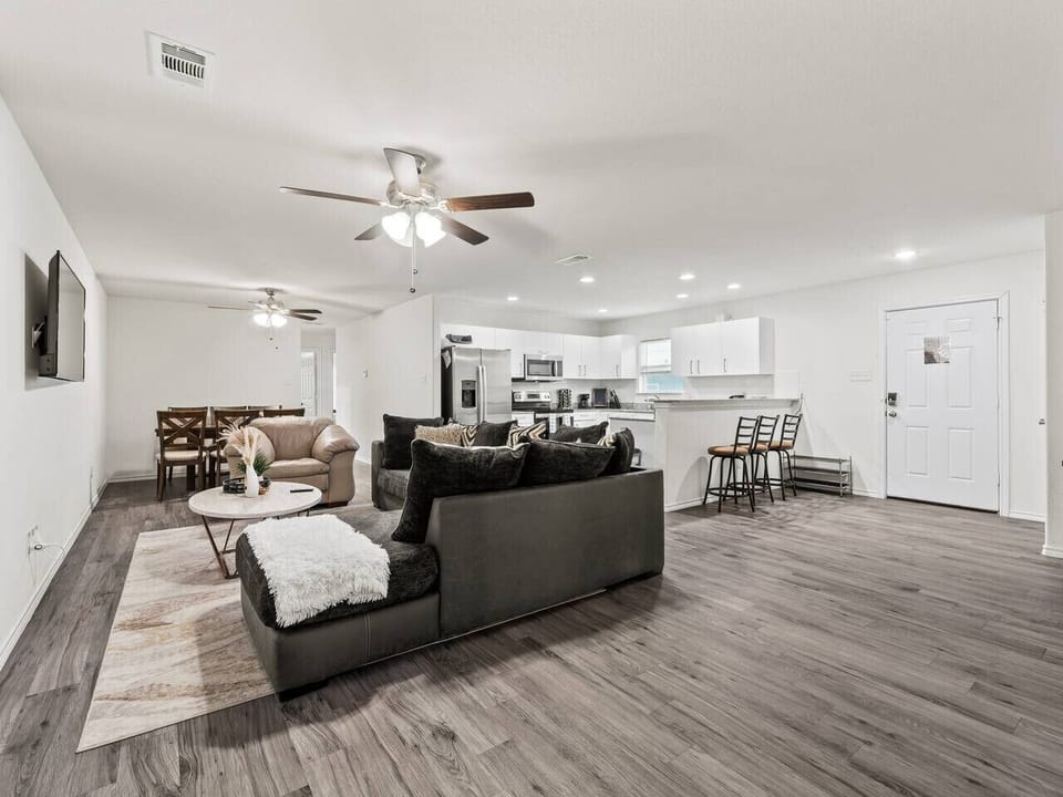 A bright and inviting living room designed for comfort and relaxation. Enjoy a cozy sofa, stylish décor, and plenty of natural light, perfect for unwinding after a long day or gathering with friends and family.