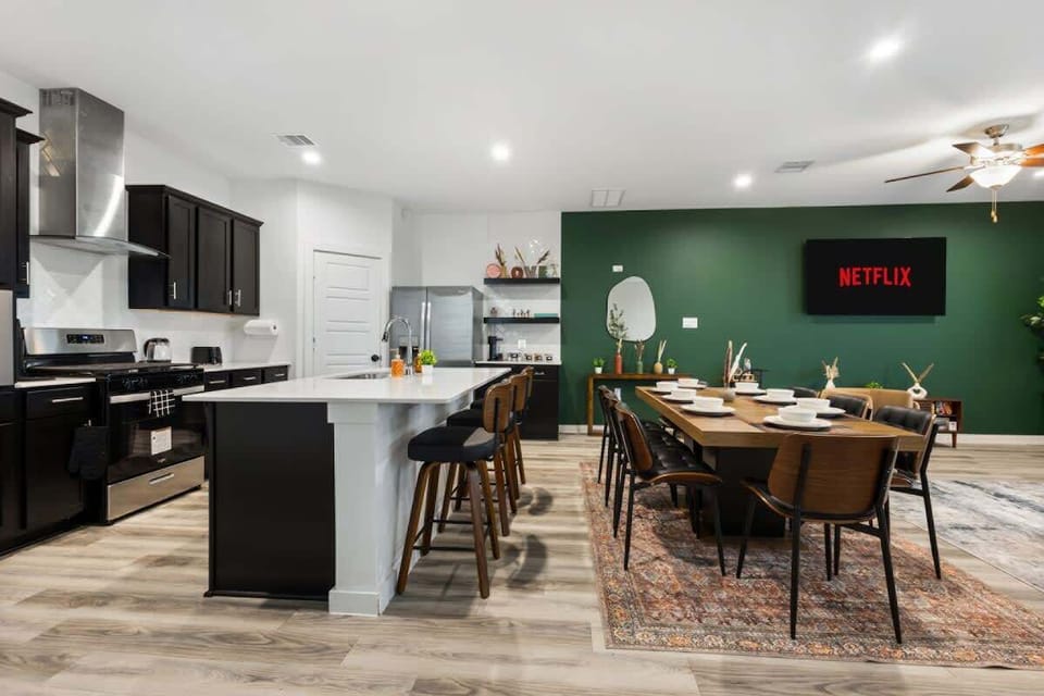[Dining Area] Gather around the 8-seater dining table for meals, games, planning, and memorable conversations.
