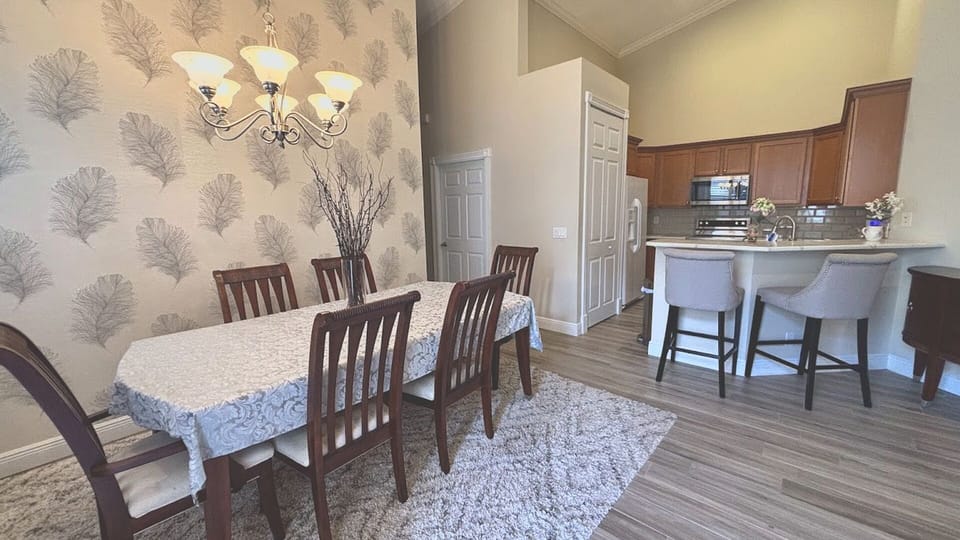 Designed for entertaining, the elegant dining space seamlessly flows into the kitchen, creating an open-concept atmosphere perfect for hosting family and friends.