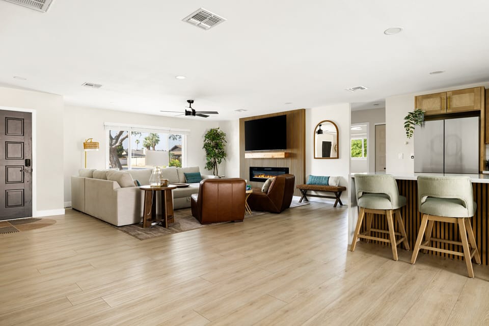 Bright open-concept living space with seamless flow between the lounge and kitchen areas.