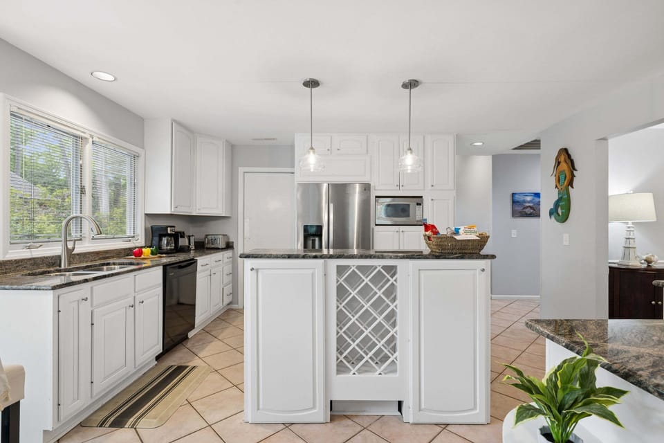 Granite countertops, abundant cabinet space, and a functional layout make cooking easy and enjoyable.
