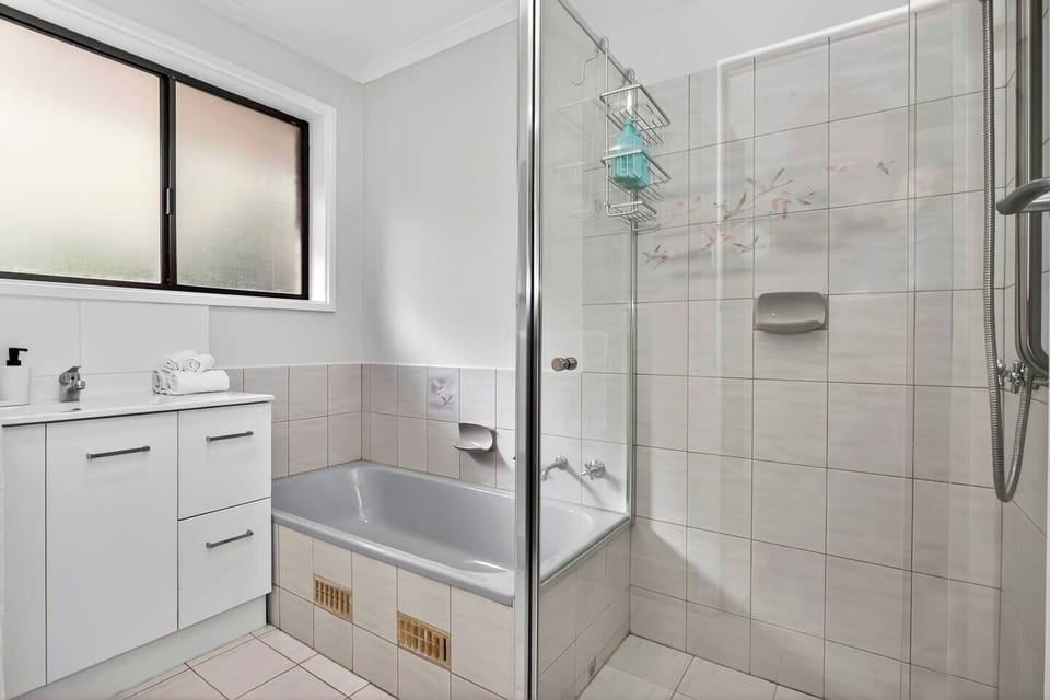 Whether soaking in the bathtub after coastal walks or preparing for the day ahead, the family bathroom offers flexibility and comfort for the whole group.