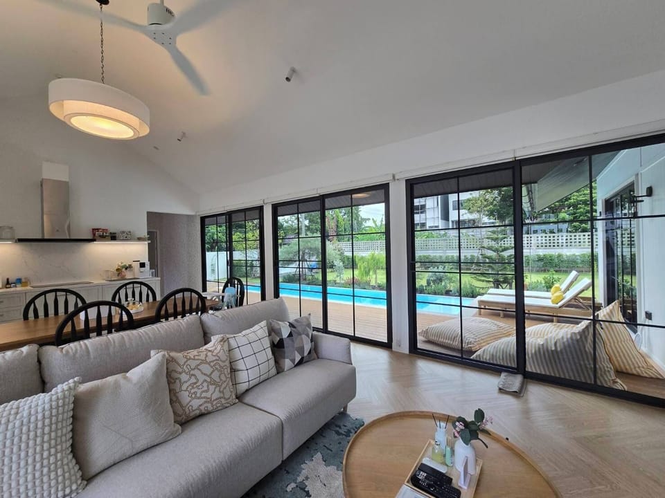 Poolside open-planned living & dining area
