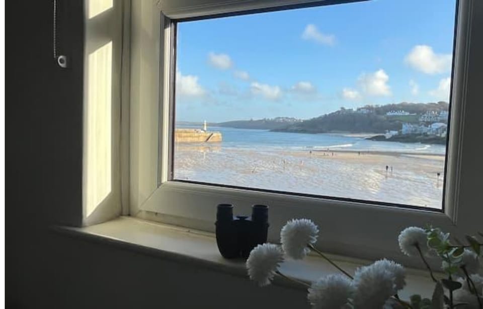 St Ives Harbour at low tide, with views across to Hayle Beach.