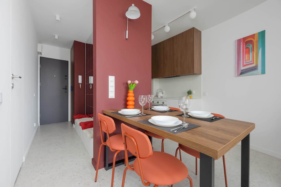 Dining area seamlessly connected to the kitchenette, perfect for enjoying meals in a modern setting.