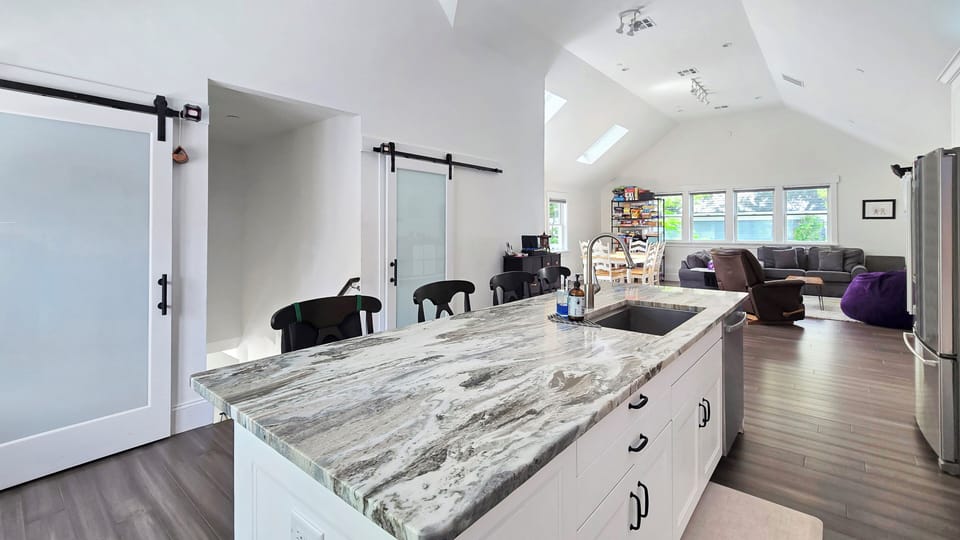 Kitchen with quartz countertops and stainless appliances