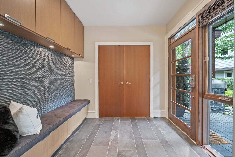 Entryway - Spacious main floor entrance with bench seating and storage