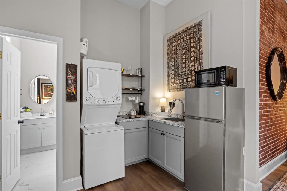 View of kitchenette, and in suite washer and dryer 