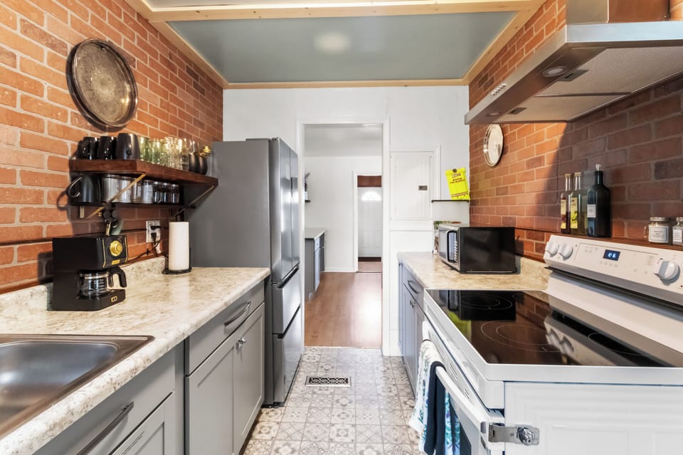 Fully equipped kitchen with modern appliances, ample counter space, and everything you need for a comfortable stay.