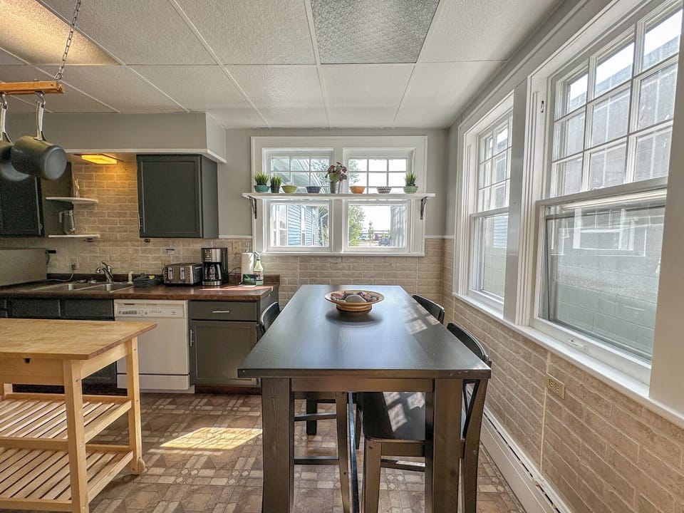 There is a breakfast table in the kitchen.