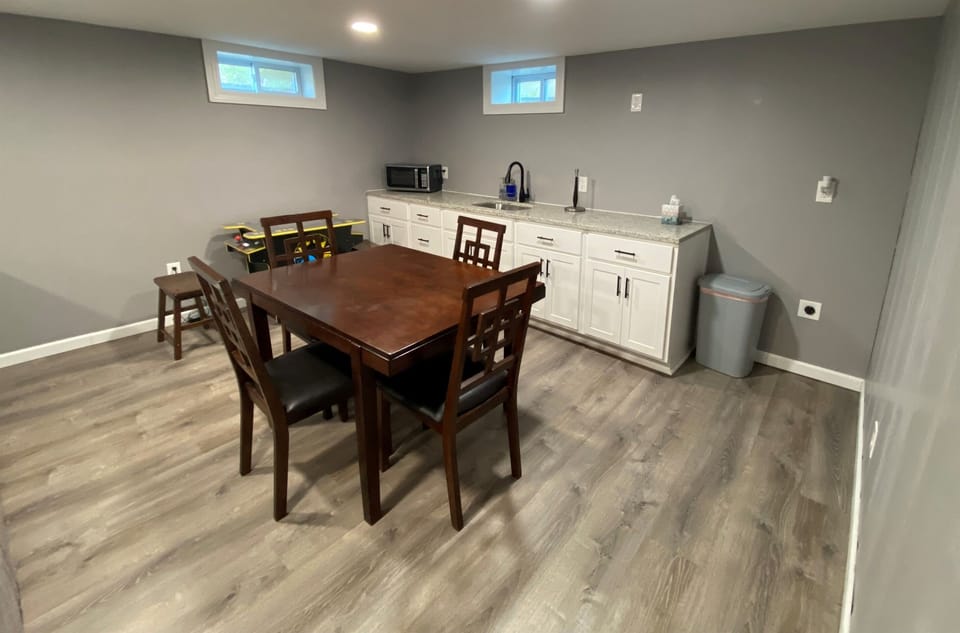 Downstairs wet bar with microwave and fridge.  