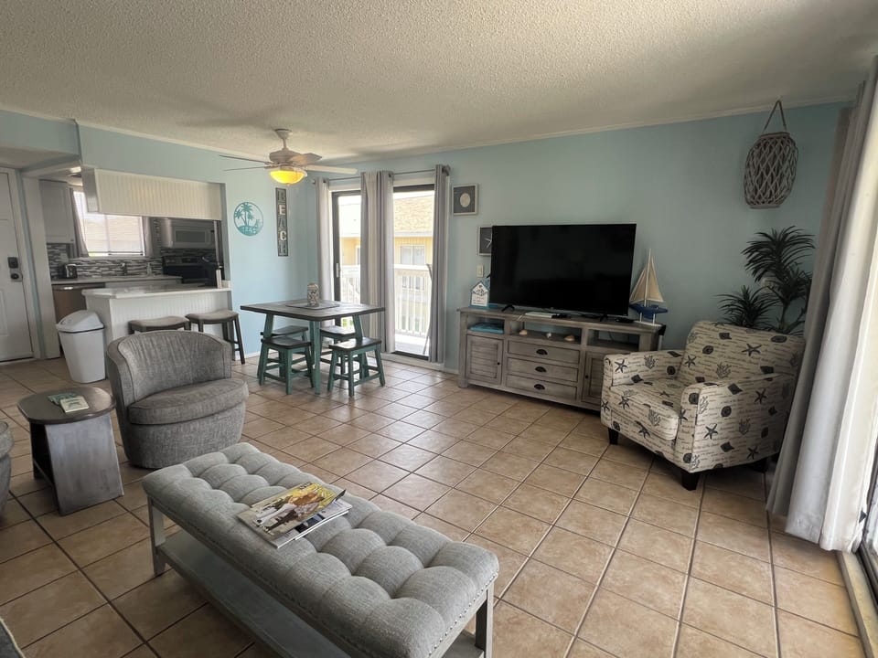 Settle into your coastal-inspired living space, where soothing colors, comfortable seating, and a bright, open layout create the perfect backdrop for relaxed evenings and easy beachside living.