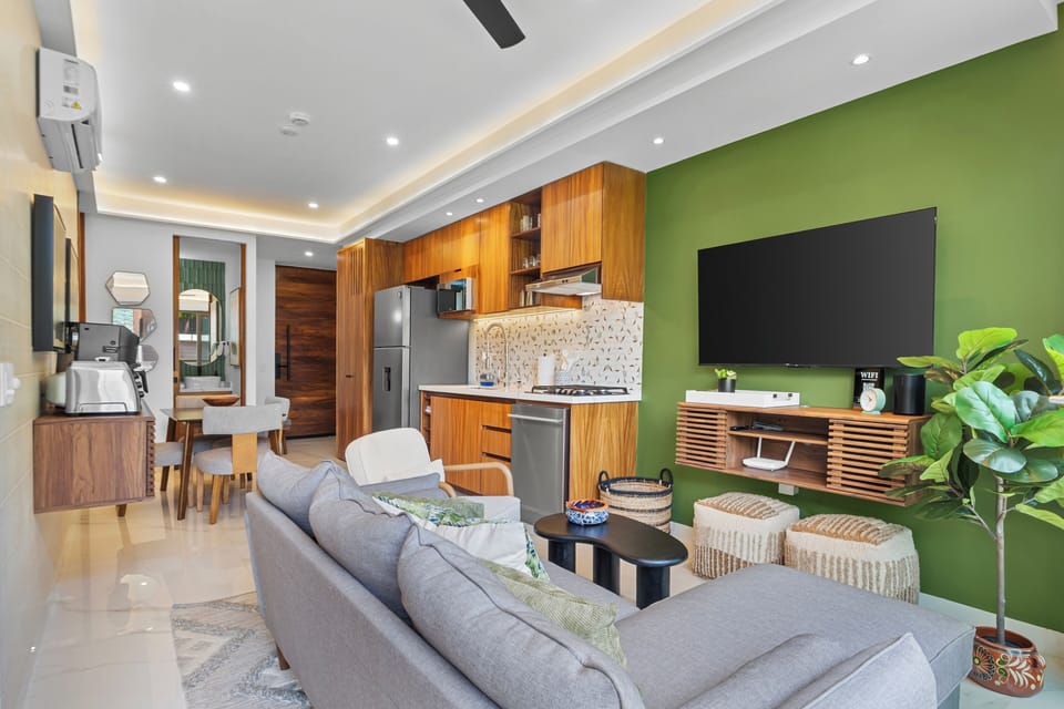 Modern open-plan stay with stylish kitchen, TV lounge, and bold design