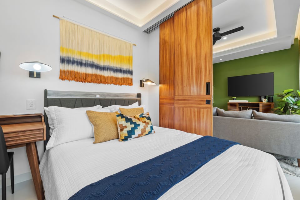 Cozy modern bedroom with sliding door to a stylish lounge area