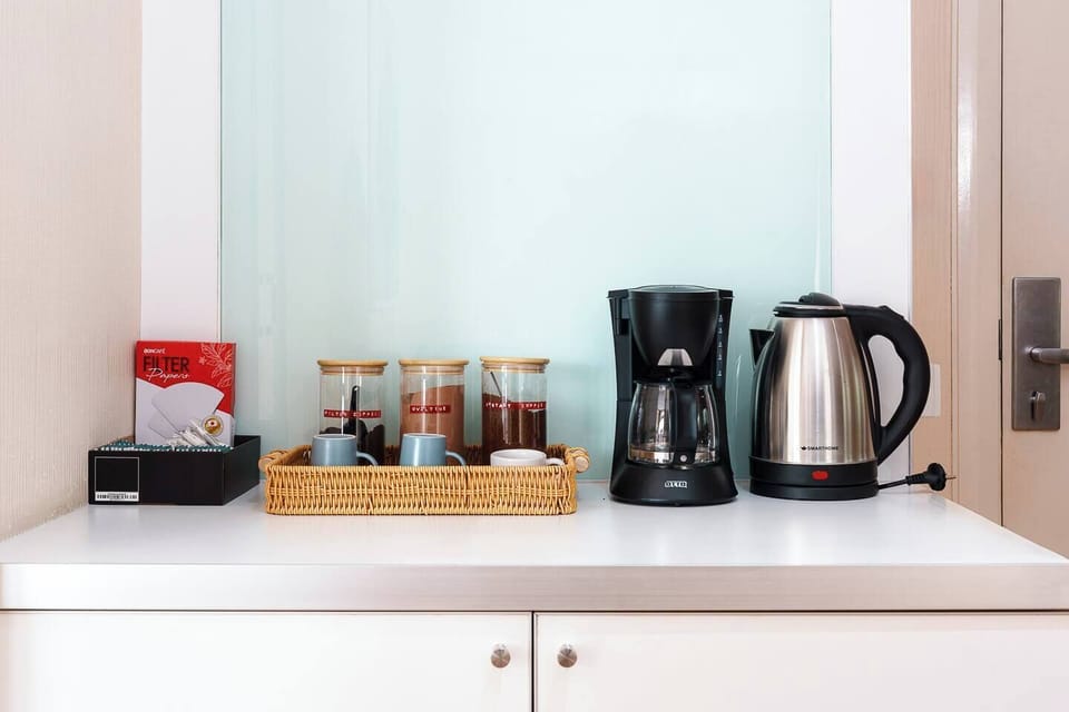 Coffee Made Easy: Coffee filters are provided and stored neatly in the basket. Enjoy fresh coffee anytime with the easy-to-use coffee maker during your stay.