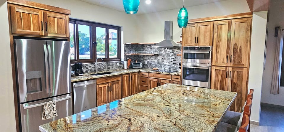 Modern and open concept Kitchen,  with all the essentials that you need to cook.