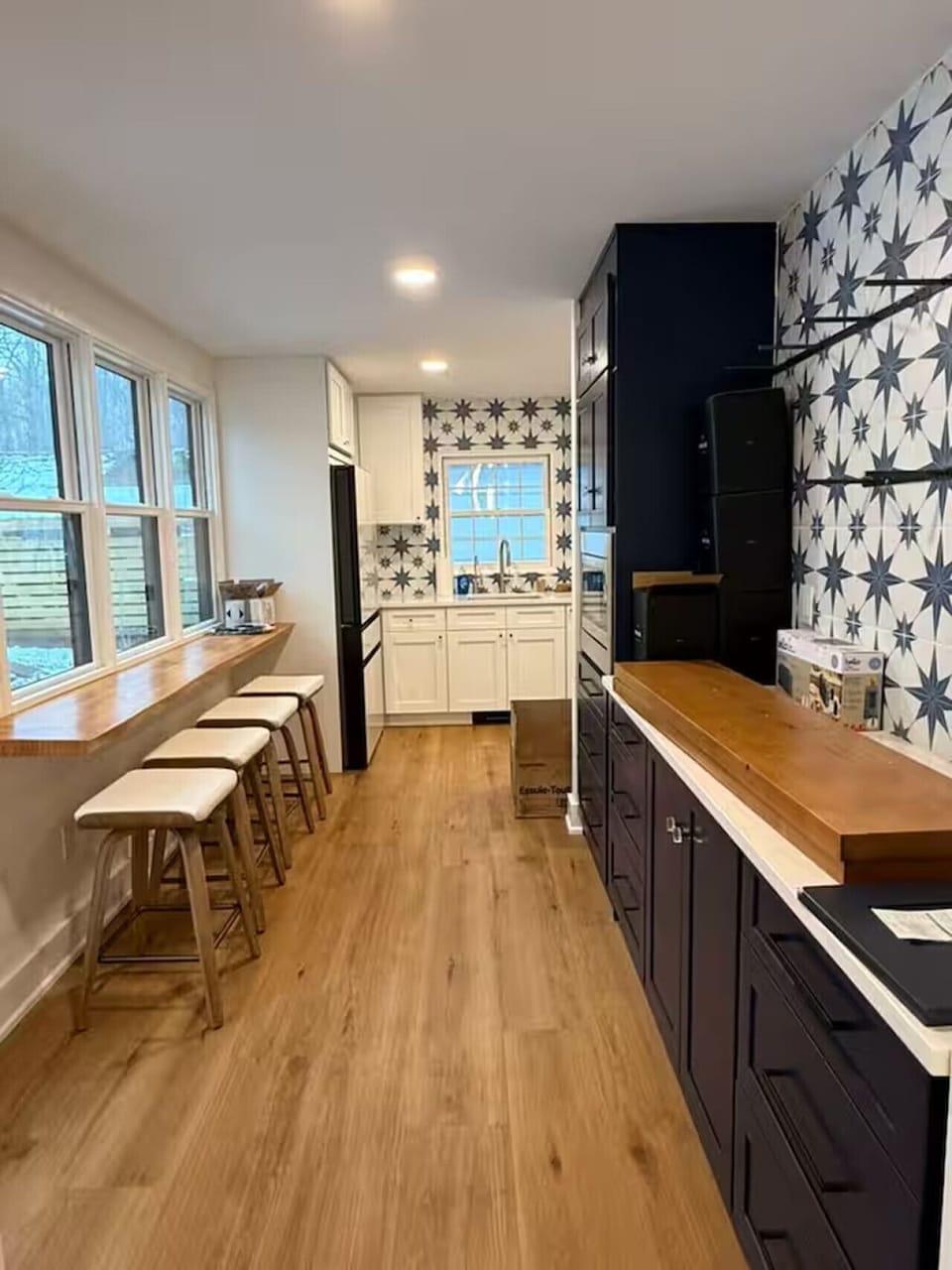 Sit at the breakfast bar and enjoy the view of the back yard, or heat up a snack in the microwave, and take it into the dinning room table.