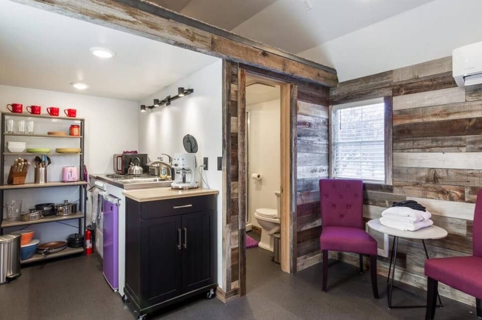 Cozy kitchenette suite with rustic charm, bold accents, and private bath