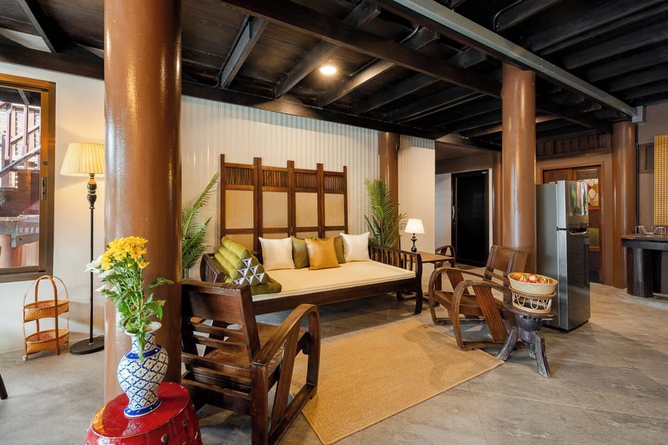 Elegant wood-accented lounge with daybed seating and timeless character