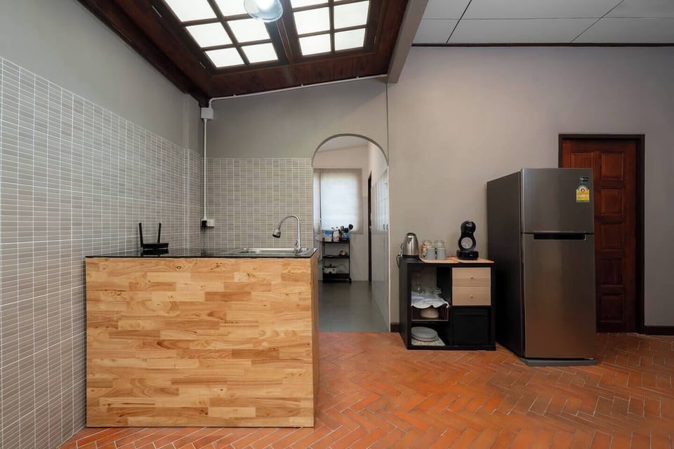 【Dining Prep Area & Coffee Station】Extra space with sink, large fridge, full utensils, and a convenient coffee setup—perfect for prepping big meals or quick breakfasts without crowding the main kitchen.