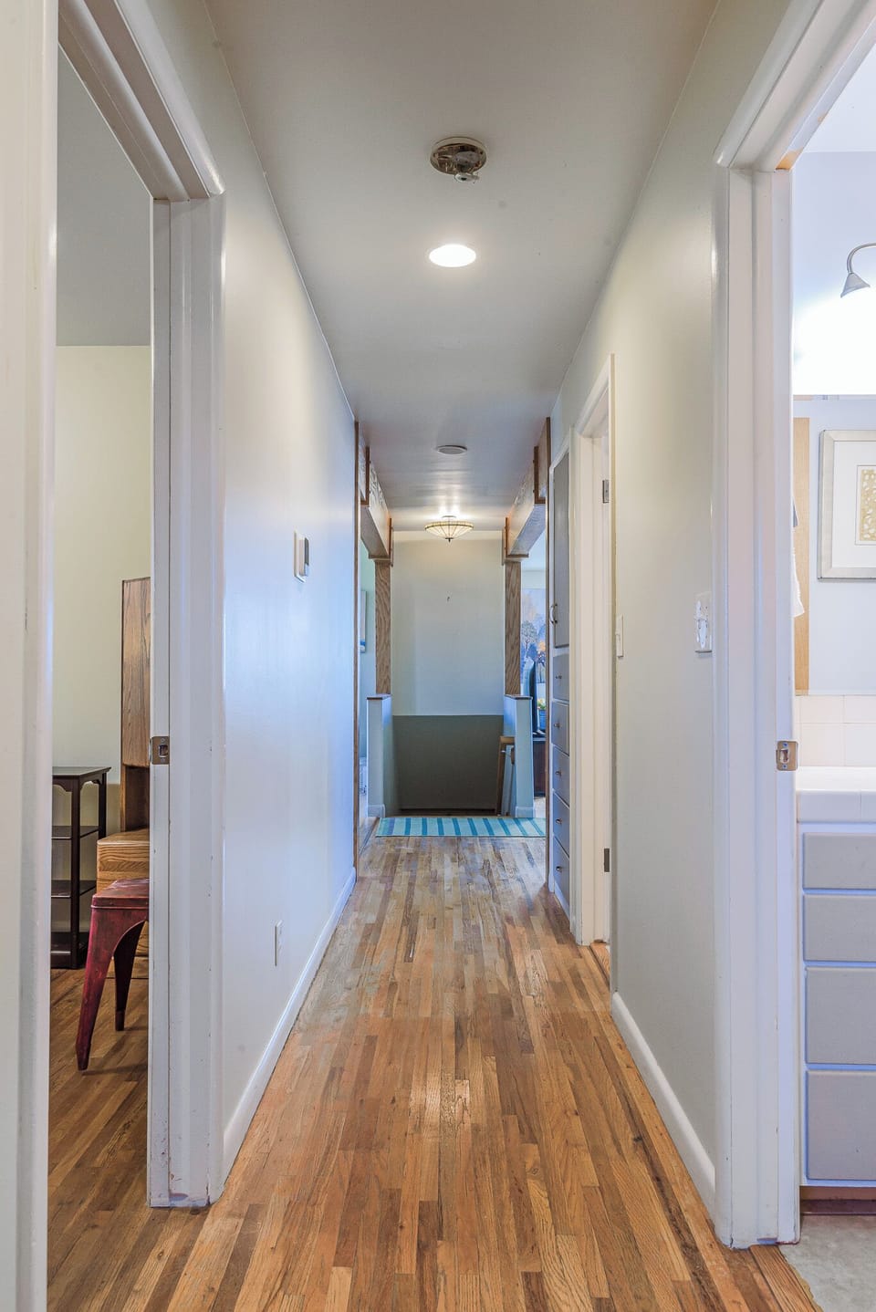 Hallway leading you right to the living spaces. Light and airy throughout.