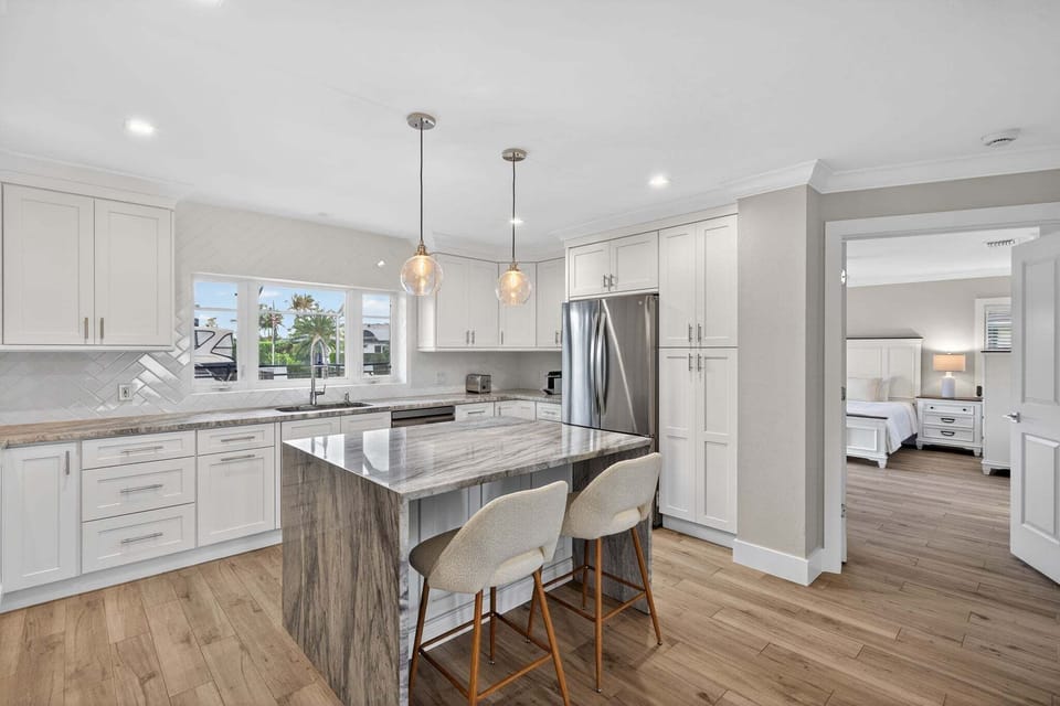 Kitchen with stainless steel appliances and breakfast bar