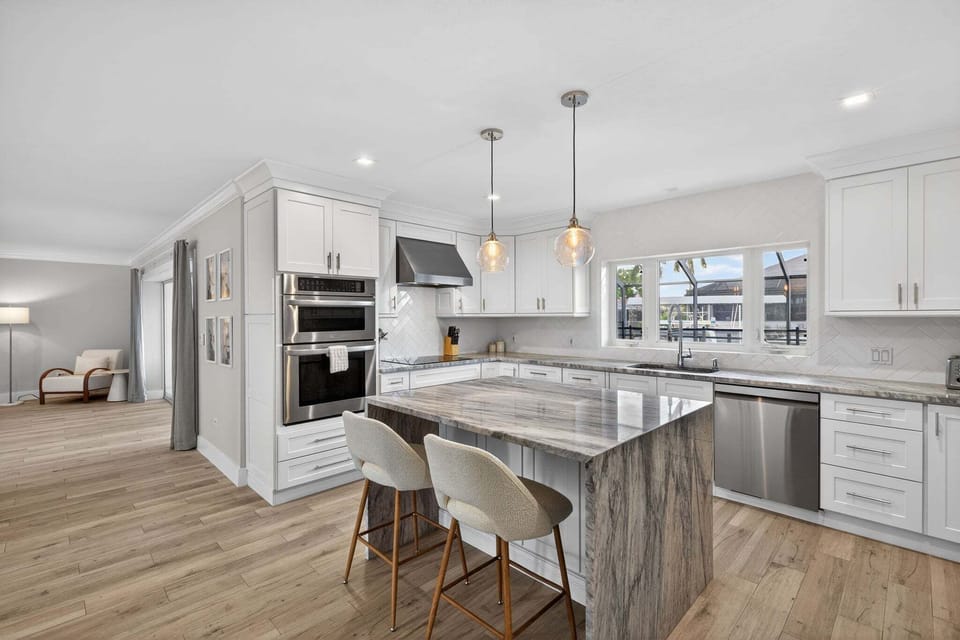 Kitchen with stainless steel appliances and breakfast bar