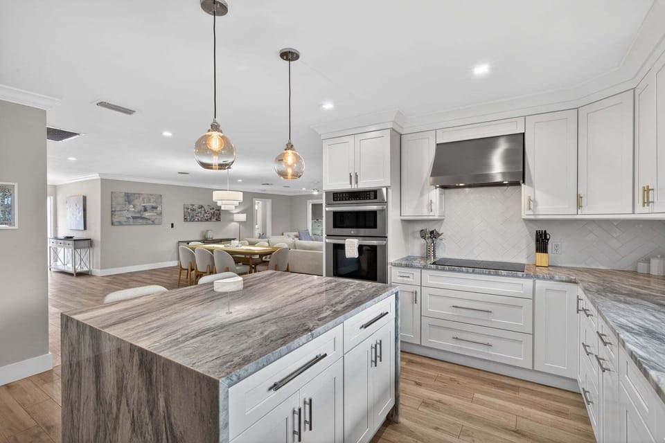 Kitchen with stainless steel appliances and breakfast bar
