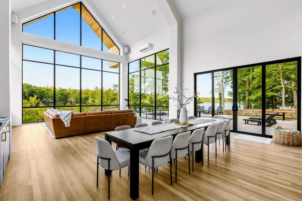 Dining Area - Natural light pours over the table from the gable of glass.